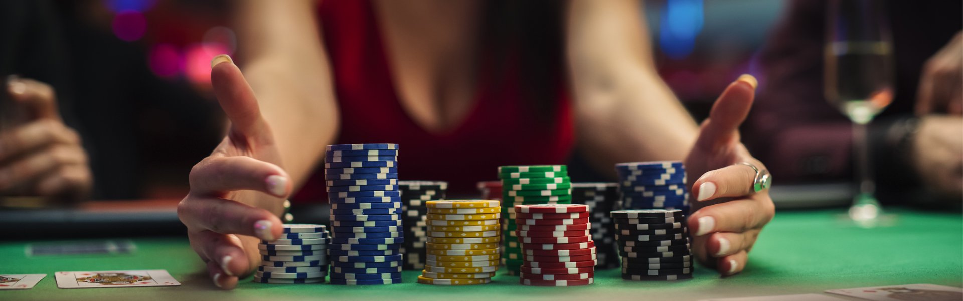 Stacks of colorful poker chips and playing cards on a casino table at Happy Valley Casino in State College, Pennsylvania.