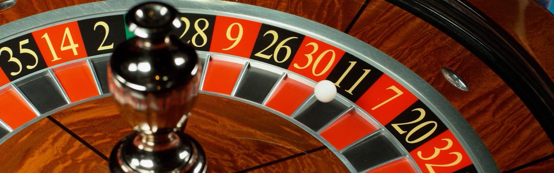 Close‑up of a roulette wheel with the ball resting on number 11 at Happy Valley Casino in State College, Pennsylvania.